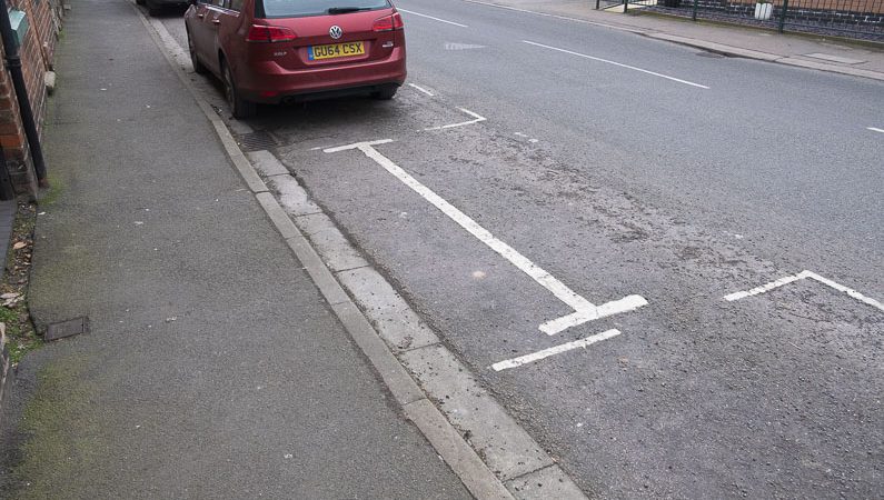 White lines on the road in the shape of a H, where access is required